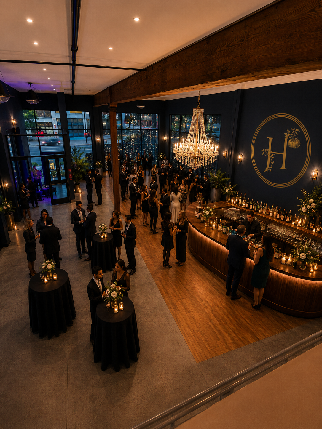 Heirloom Seattle event floor with chandelier and gold H crest